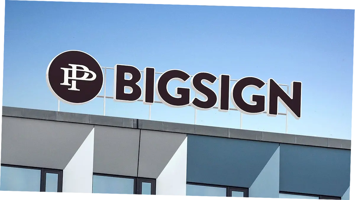 Commercial building signage installed on an office building exterior