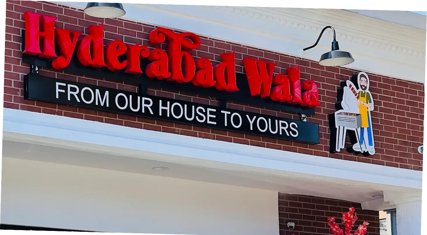 Illuminated exterior business signage for storefront branding and visibility